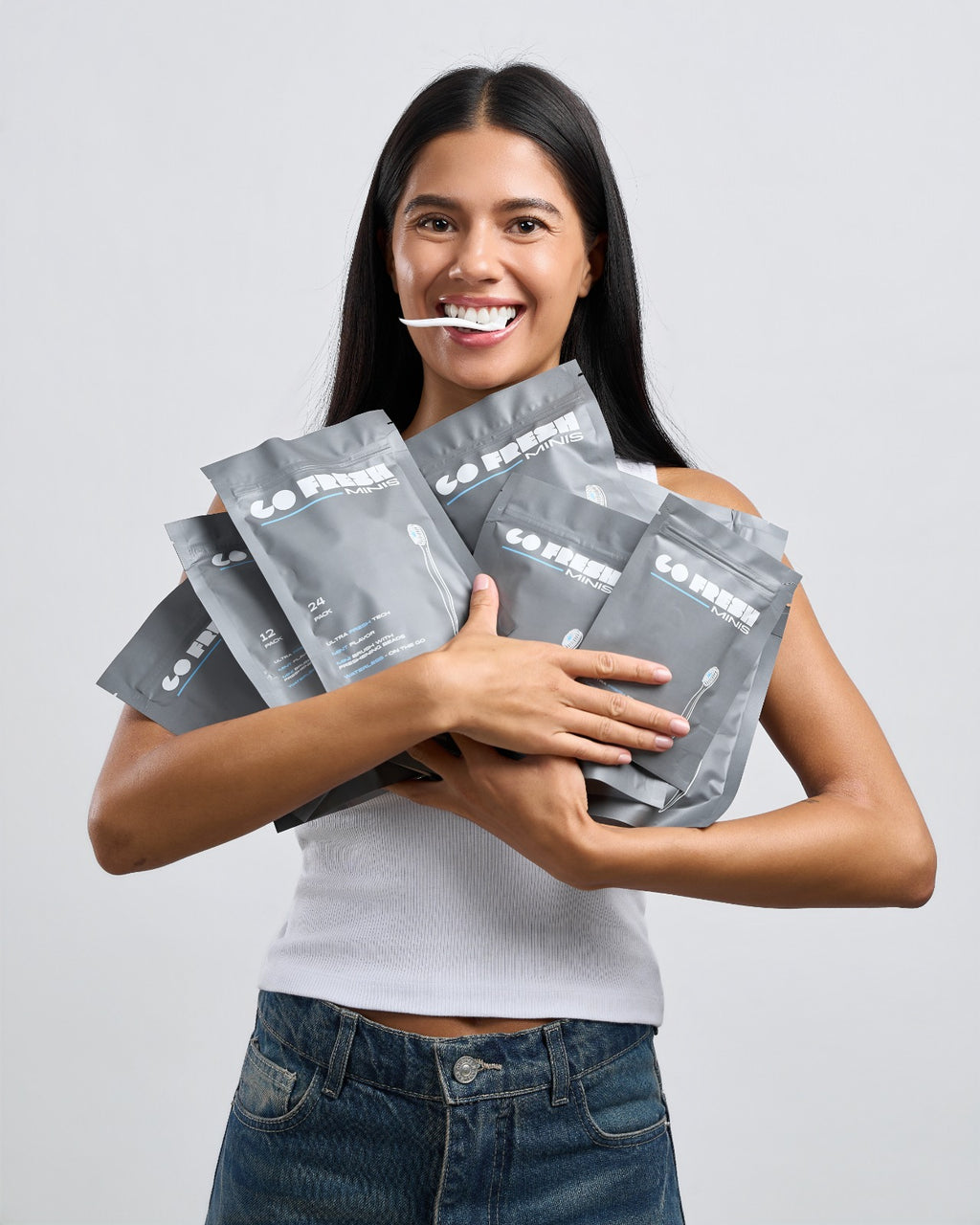 Woman holding an armful of Go Fresh Minis packs